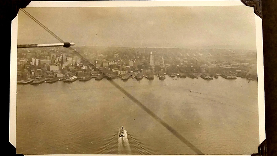 Image: A shot of the downtown Seattle skyline taken, circa 1929, from an open-seat plane flying ove...