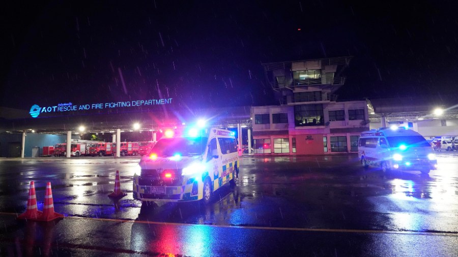 Image: Ambulances are seen at the airport where a London-Singapore flight that encountered severe t...