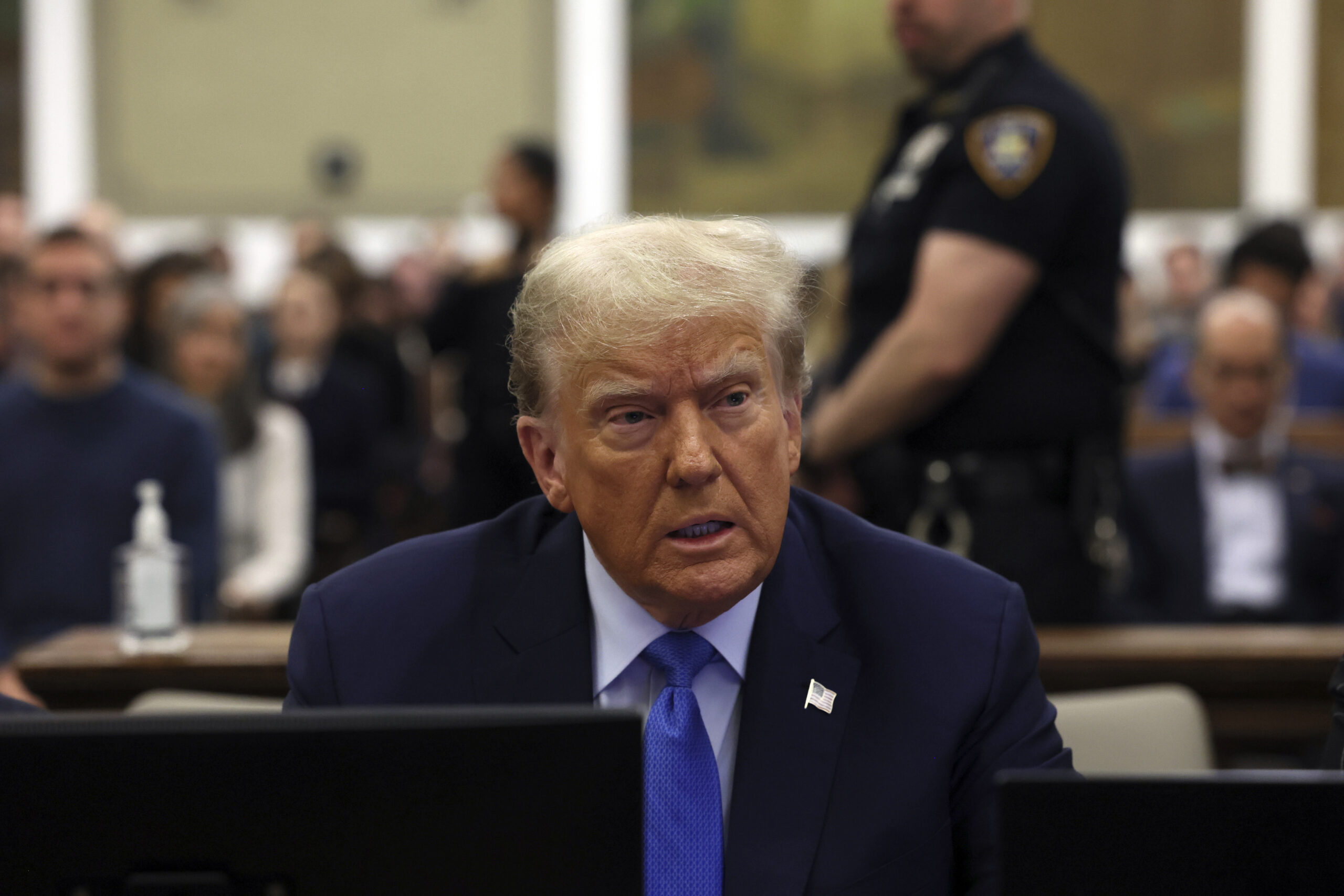 FILE - Former President Donald Trump waits to take the witness stand during his civil fraud trial a...