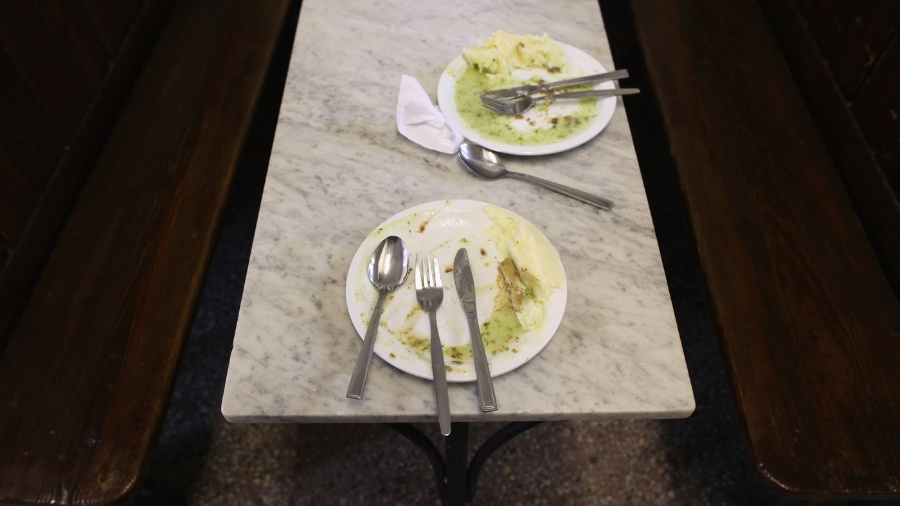 Image: Empty food plates are seen in London....