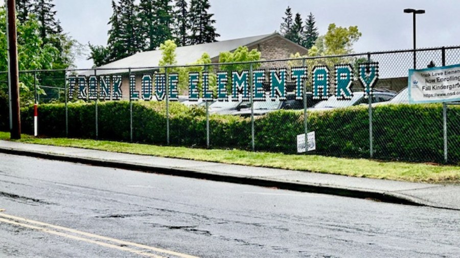 Image: A sign for Frank Love Elementary School in Bothell can be seen in a fence at the school....