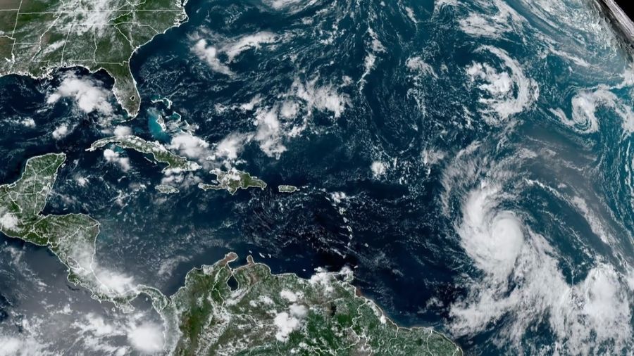 Photo: This Wednesday, Sept. 6, 2023, satellite image shows Hurricane Lee, right, off in the centra...