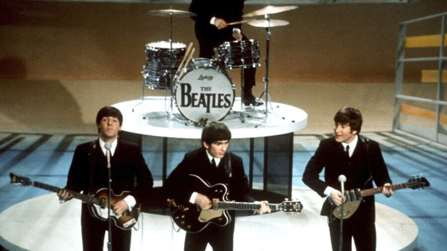FILE -The Beatles, foreground from left, Paul McCartney, George Harrison, John Lennon and Ringo Sta...