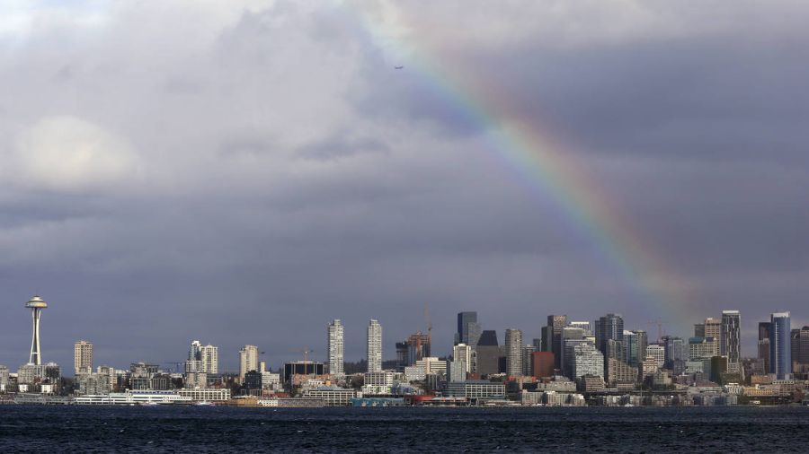 Photo: A rainbow briefly lights up over downtown Seattle, in Western Washington, and the Space Need...