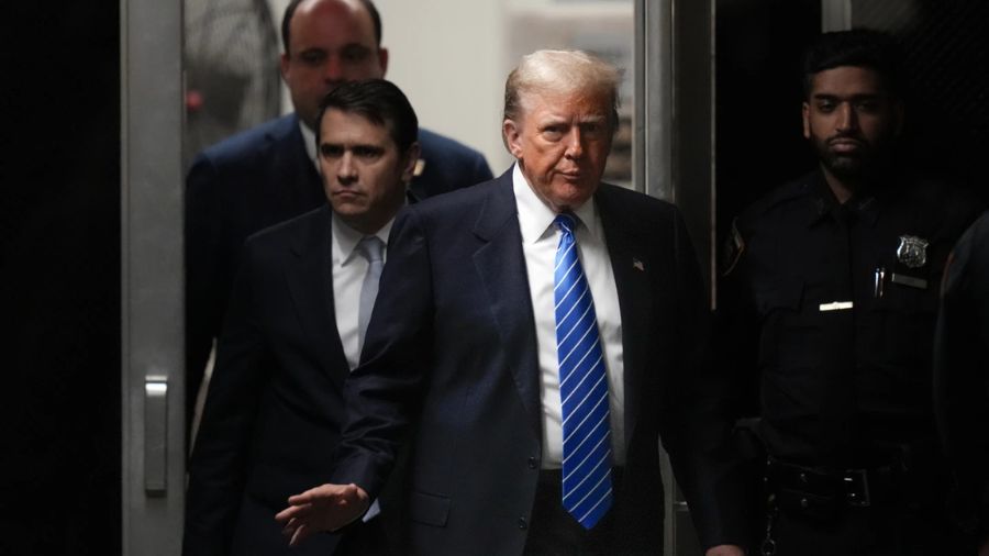 Photo: Former President Donald Trump returns to the courtroom after a break at Manhattan criminal c...