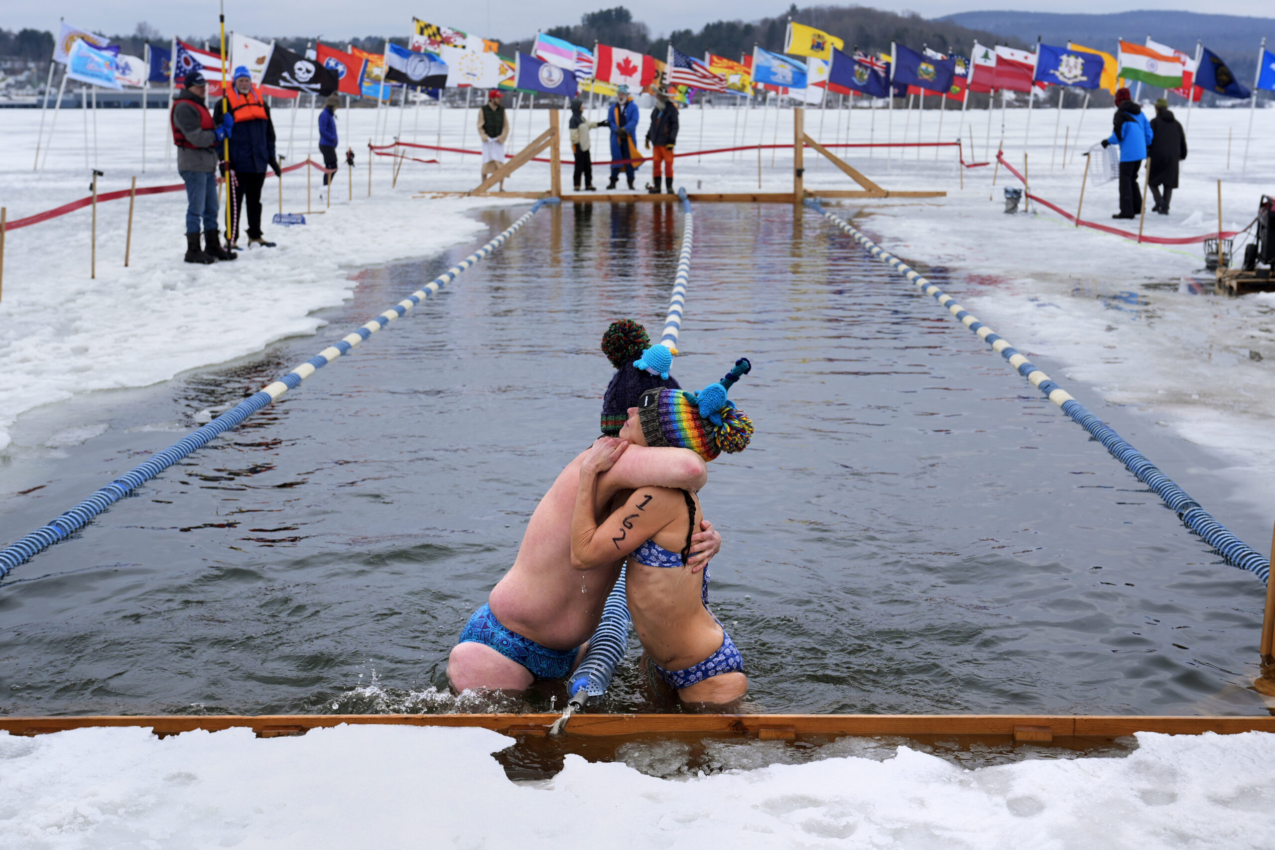 Andie Nelson, right, embraces Brian Jaskot, both of Virginia, after their race during the 25 meter ...