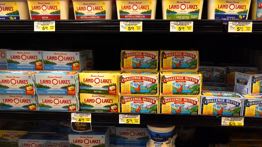 Image: Butter products and their price tags are displayed on shelves at a grocery store on Sept. 22...