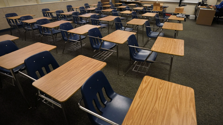 Photo: Empty desks at Twentynine Palms Junior High School in Twentynine Palms, Calif., Aug. 18, 202...