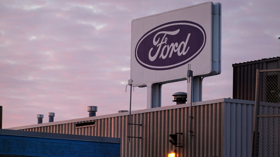 Image: The Ford company logo is displayed on a sign outside of the Chicago Assembly Plant in Februa...