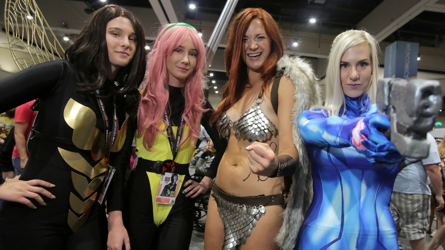 From left, women play the parts of Wasp from Marvel Comics, Pixie from X-Men, Red Sonja from Marvel...